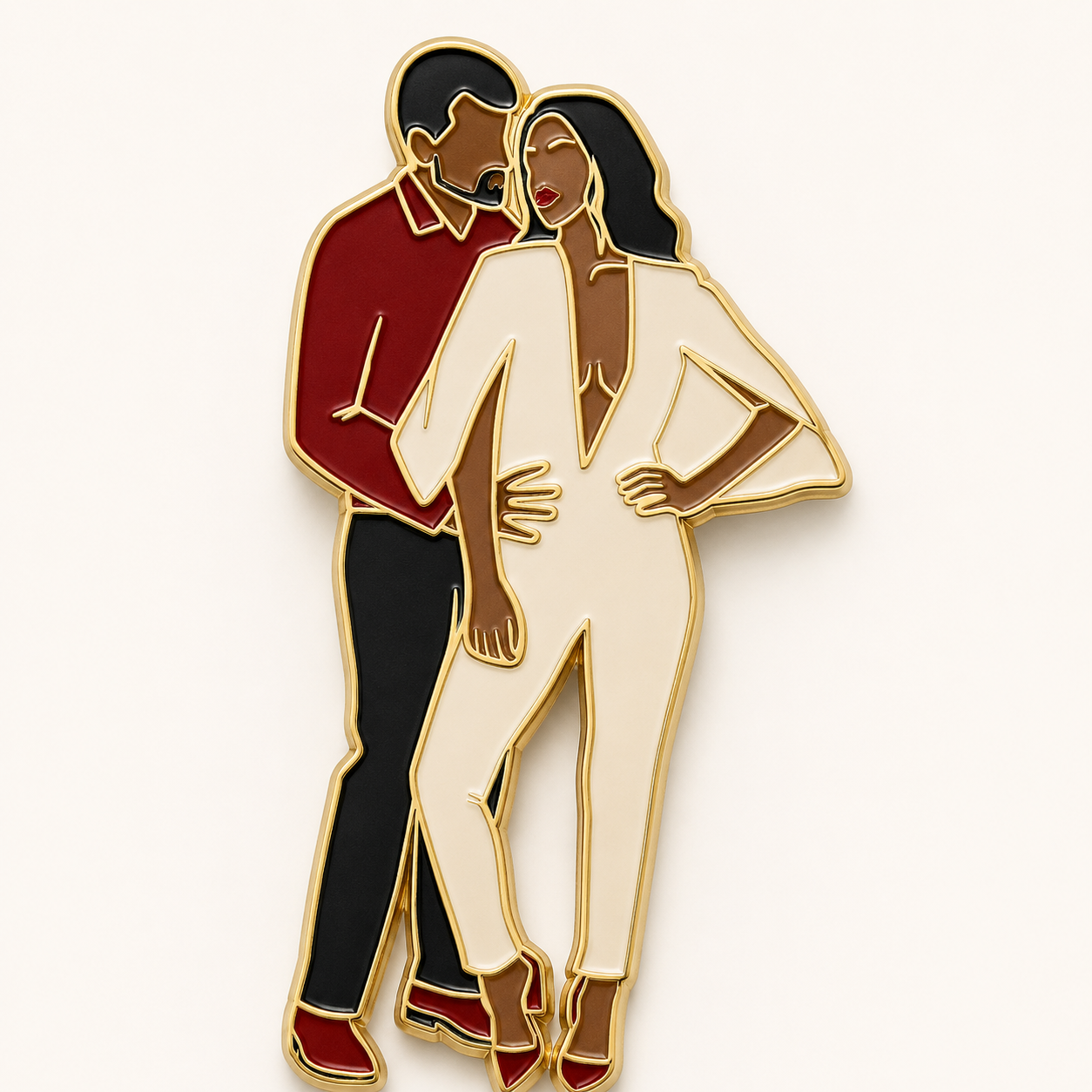 Custom enamel pin of a couple in red and cream formalwear with gold outlines